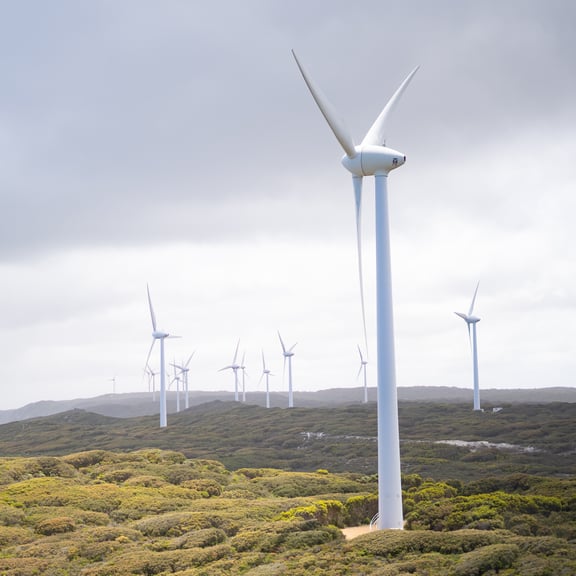 photo-of-wind-turbines-under-cloudy-sky-3619870